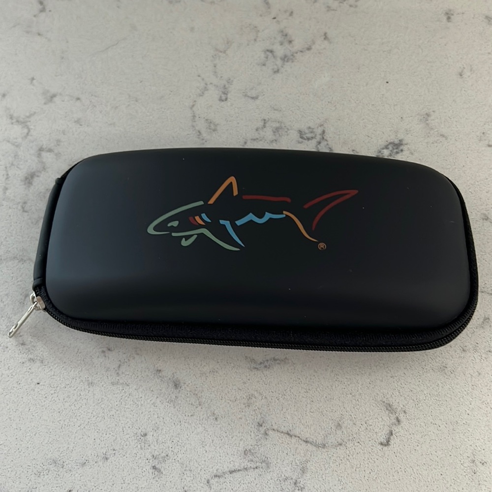 Greg Norman sunglasses case.